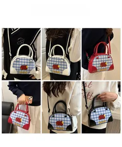 Multiple grid views of plaid crossbody bags with red apple motif and thin shoulder straps