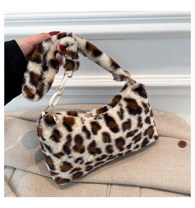 Detail of leopard print faux fur shoulder bag with acrylic chain and soft texture