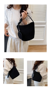 Détail du sac seau noir mat avec bandoulière à nœud et mini pochette ronde incluse