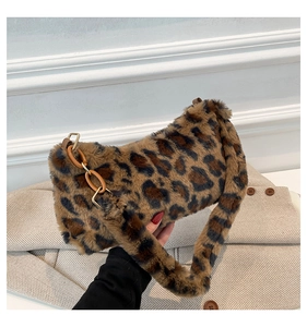 Detail of leopard print faux fur shoulder bag with warm texture and metal ring buckle
