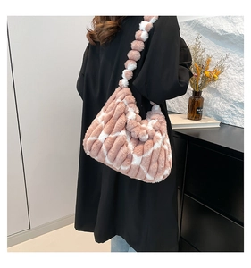 Detail of soft pink and white checkered plush tote bag showing fluffy faux fur texture
