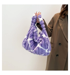 Detail of plush striped tote bag featuring purple and white faux fur with soft texture