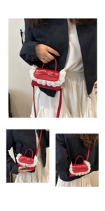 Detail of red ballet style square bag featuring lace trim and bow knot decoration
