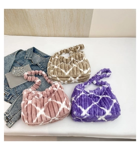 Macro detail of plush striped tote bags with heart patterns in pink, purple, and brown