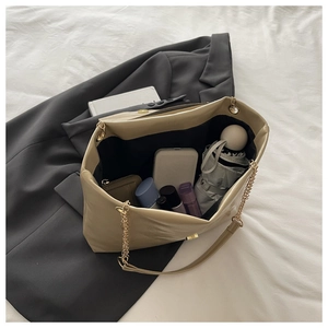 Detailed interior of khaki leather tote bag showing spacious capacity for daily essentials