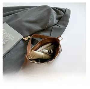 Interior storage view of the vintage monogram shoulder bag with leather trim detail