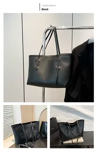 Detailed views of a spacious black tote bag featuring smooth faux leather and twin handles