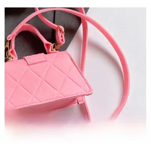 Detailed macro view of pink quilted texture and high-quality felt fabric of the handbag