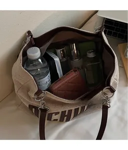 Top view of spacious canvas tote bag showing large capacity for laptop and daily essentials