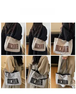 Detailed views of high-capacity canvas tote bags with MCAOIA lettering in various colors