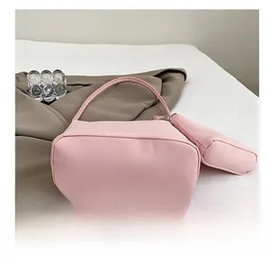 Detail view of pink nylon tote bag set showing reinforced wear-resistant flat bottom base