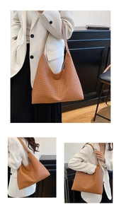 Close-up of the intricate cross-woven texture on the brown leather hobo shoulder bag