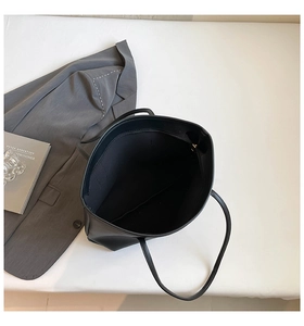 Top view of spacious interior with zipper pocket in this black minimalist tote bag