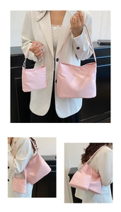 Pink nylon handbag set with shoulder bag and mini pouch showing texture and details