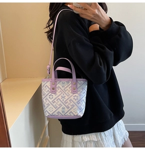 Detail of lavender bucket bag with floral embroidery and detachable shoulder strap
