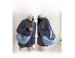 Nylon crescent bag showing two ways to wear as a shoulder bag and crossbody with adjustable strap