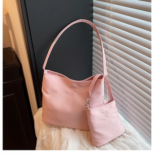 Pink two-piece tote bag set with embossed Enjoy Life logo on soft matte fabric