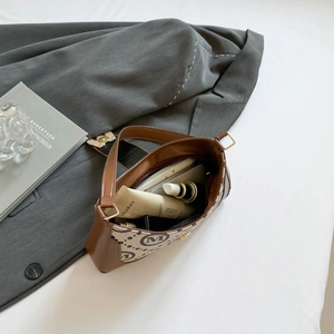 Vintage French baguette bag with letter print showing interior storage capacity