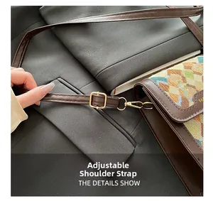 Detail of adjustable leather strap with golden metal buckle on retro crossbody bag