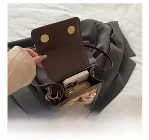 Overhead view showing the spacious interior of the brown vintage crossbody bag