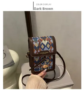 Detail of vintage crossbody bag showing geometric knit fabric and brown leather flap