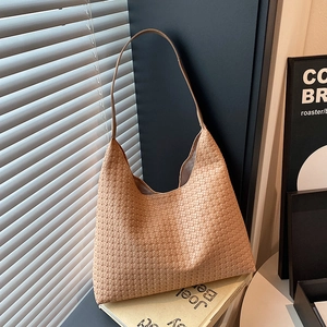 Retro woven shoulder bag in beige featuring minimalist design and large capacity for women