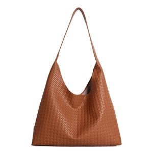 Brown woven leather tote bag with large capacity and stylish hobo silhouette for women
