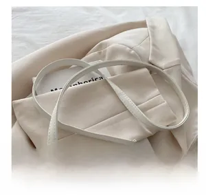 Detail of slim white shoulder strap on sweet cherry print crossbody bag for women
