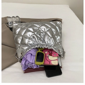 Silver quilted tote bag interior view showing large capacity for umbrella and accessories