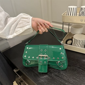 Y2K style bright green patent leather shoulder bag with silver studs and belt buckle