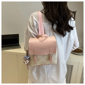 Detail of pink and white mini backpack with butterfly prints and fashion lettering
