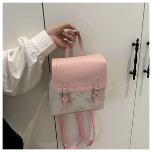 Detail of pink and white mini backpack with butterfly print and magnetic flap buckle