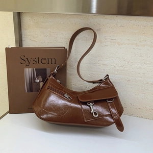 Brown faux leather crescent underarm bag with vintage metal buckles and shoulder strap