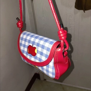 Plaid woolen crossbody bag in red white and blue with apple logo and red shoulder strap