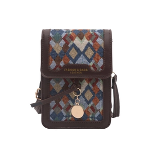Retro geometric pattern crossbody bag with brown leather trim and golden metal pendant