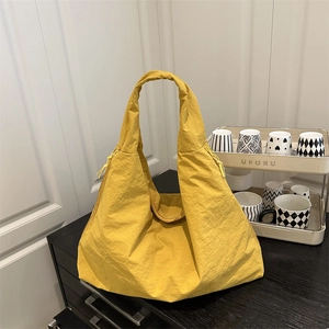 Minimalist large ginger yellow nylon tote bag with drawstring for daily commute