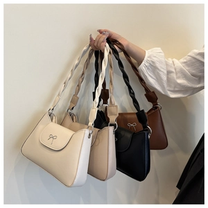 Detailed view of women's underarm bags in four colors with bow buckles and braided straps