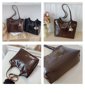 Detail view of the large capacity tote bag featuring glossy PU leather and fashion charms