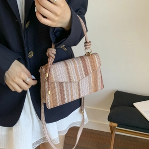 Striped woven shoulder bag with rope knot handle and adjustable crossbody strap