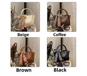 Detail of four matte leather bucket bags with plaid silk scarves in various colors