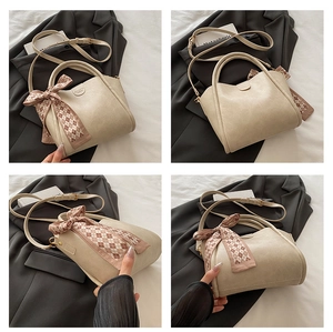 Detailed views of beige PU leather bucket bag with decorative silk scarf and shoulder strap