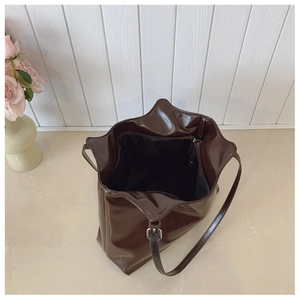 Deep coffee glossy tote bag interior with black lining and secure zipper pocket