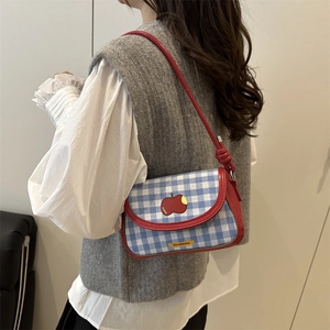 Blue and white checkered shoulder bag with red apple motif and thin red straps