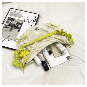 Internal view of beige tote bag showing large capacity for tablet and cosmetics