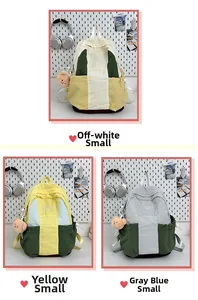 Detailed view of nylon backpacks in contrast colors with cute bear charms and side drawstrings
