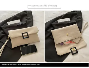 Detail view of beige envelope clutch bag showing the spacious inner main compartment