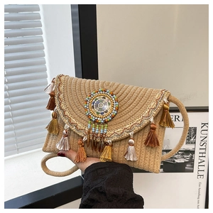 Ethnic straw woven envelope bag with colorful tassels and bohemian embroidery detail