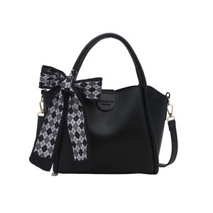 Solid color bucket bag in black faux leather with a large checkered ribbon bow detail