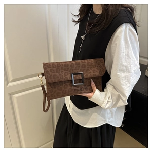 Detail of leopard print envelope clutch bag with buckle and convenient wrist strap