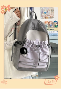 Detail view of large-capacity canvas backpack with color-blocking and drawstring design